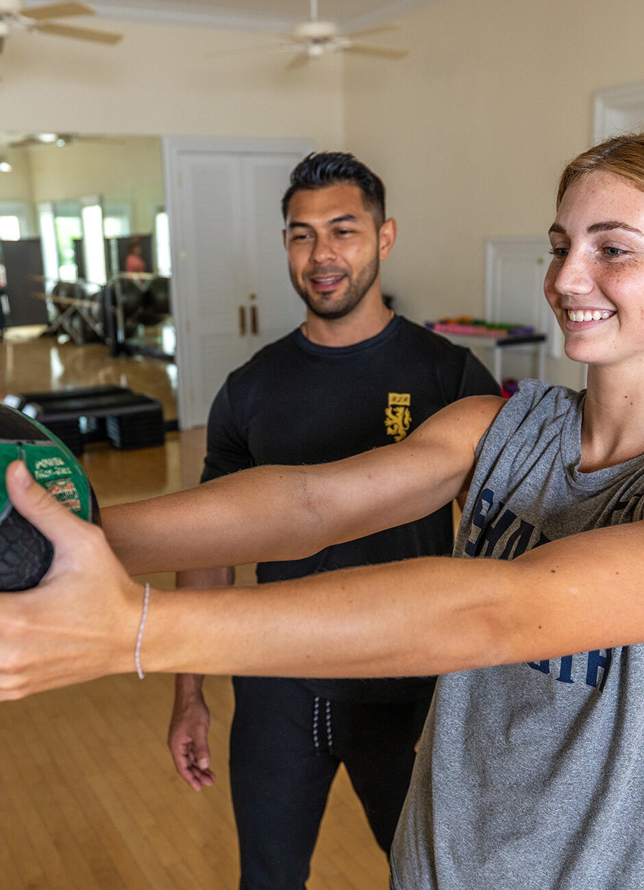 woman and personal trainer exercising